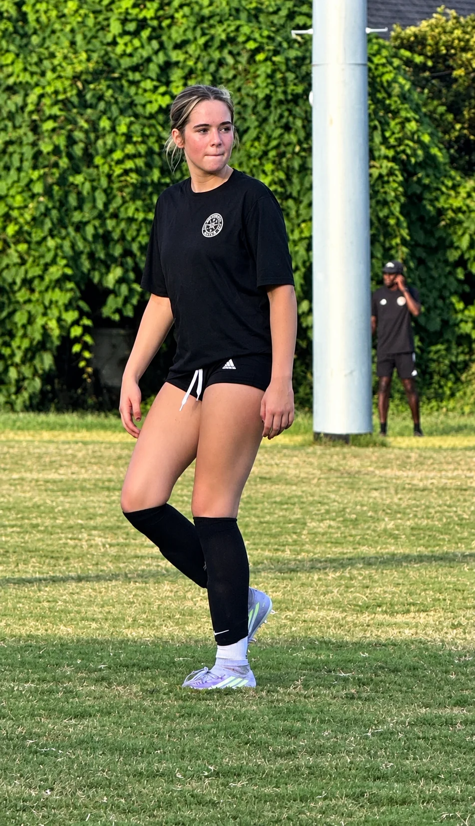 Catherine Page walking onto the training field